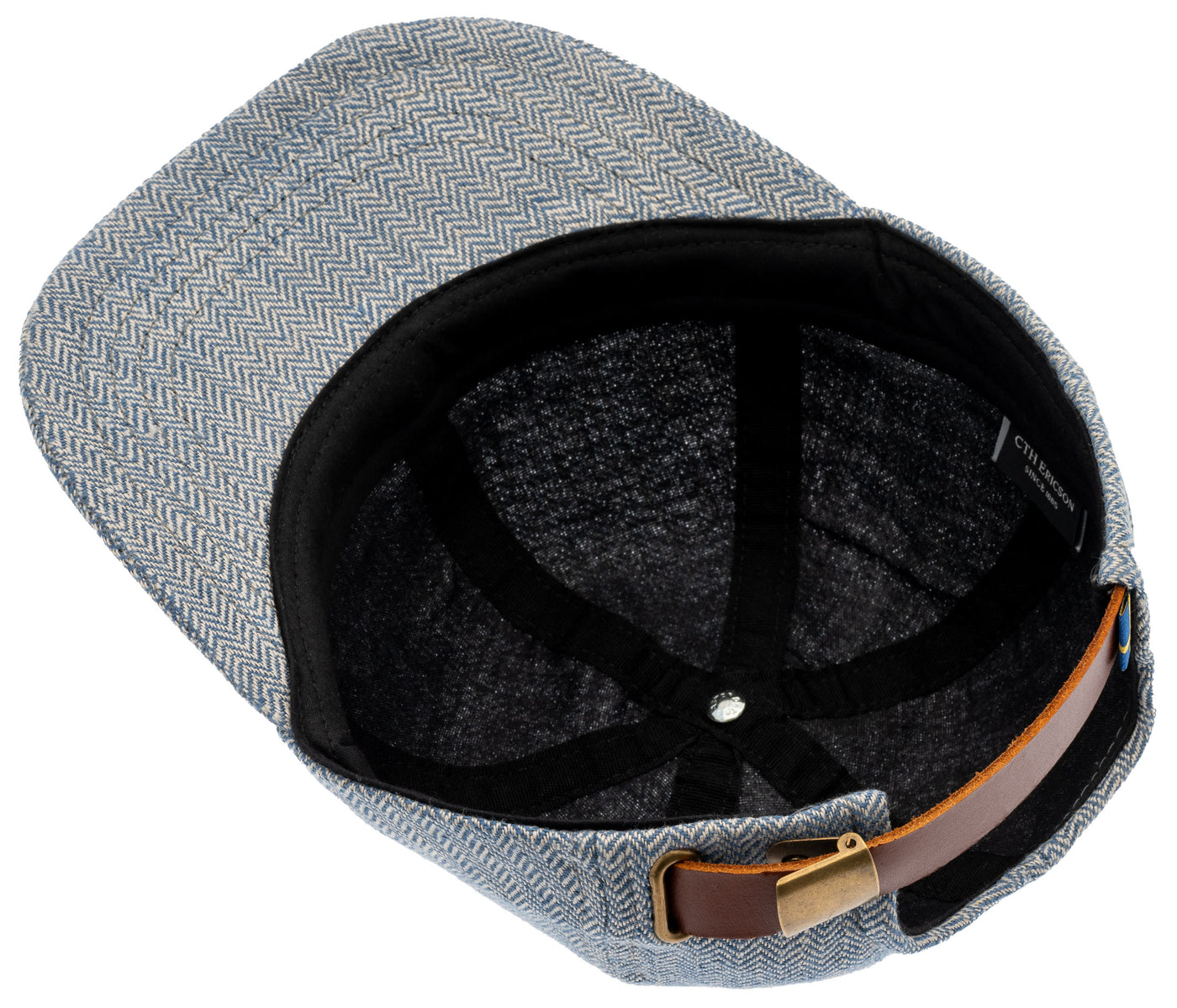 Blå linne keps med svart foder och brunt spänne i läder