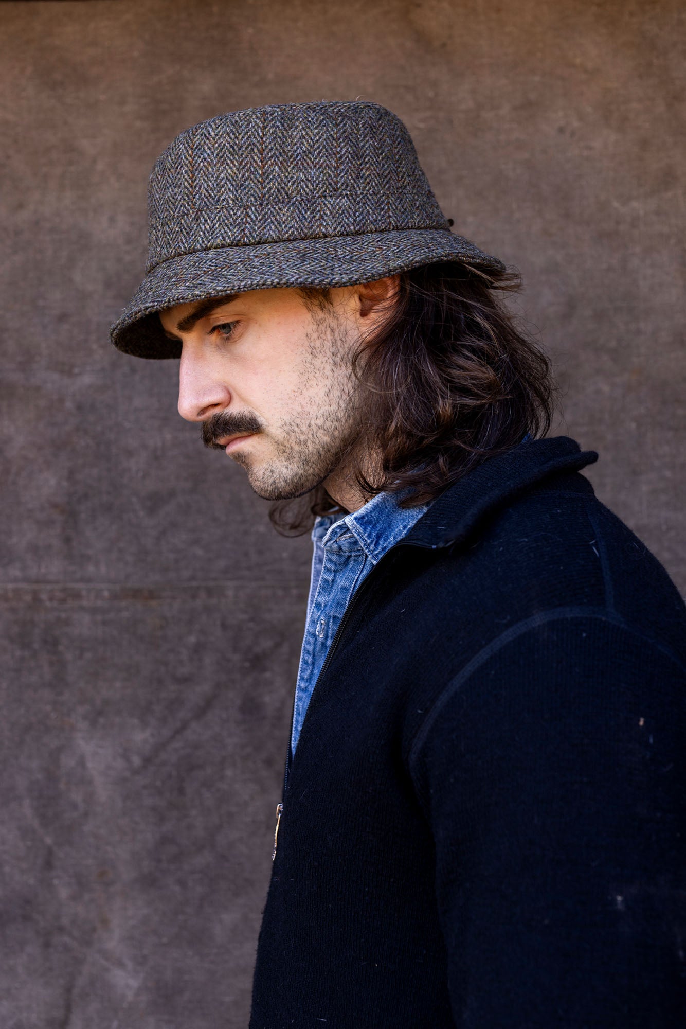 Man in green Harris Tweed Walking hat