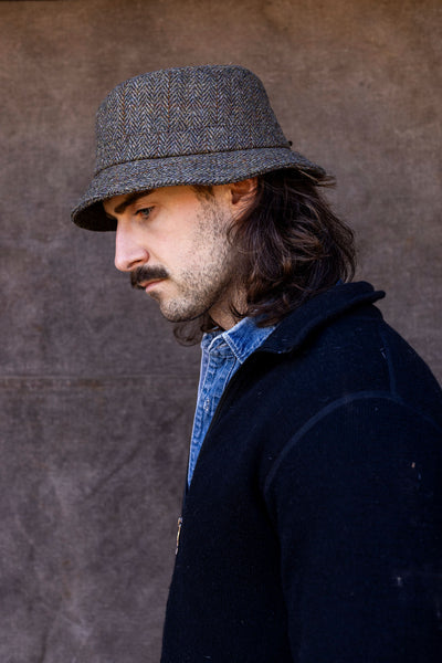 Man in green Harris Tweed Walking hat