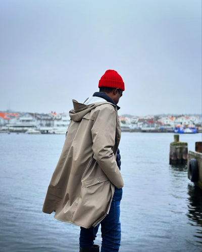 Man in a red knitted Watch cap at sea