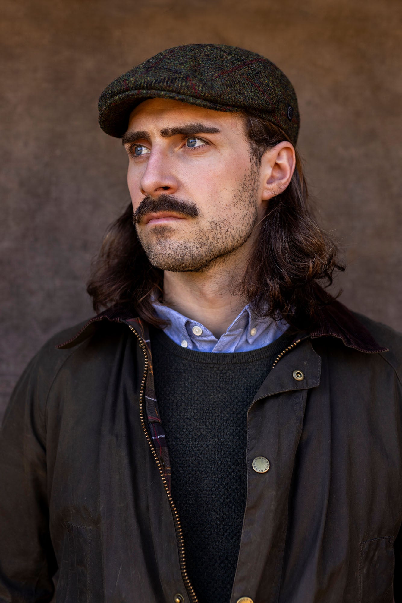 Scottish man in green Harris Tweed Ivy cap