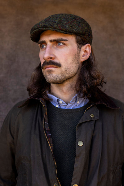 Scottish man in green Harris Tweed Ivy cap