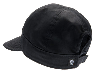  Black womans cap with large peak.