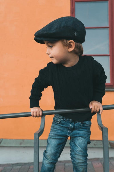 Young boy with blue flat cap